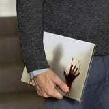 A business man holds Personalized VistaCase reMarkable Pen Holder Case with Horror design